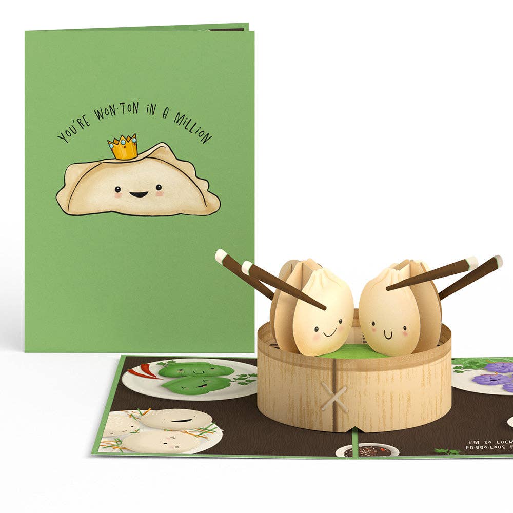 Dim sum friendship card open beside its green cover