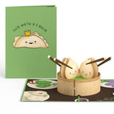 Dim sum friendship card open beside its green cover