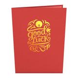 Red card cover with gold Good Luck lettering