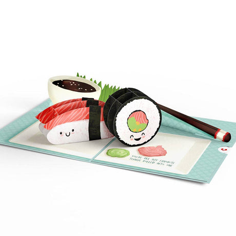 Open sushi pop-up card with smiling rolls and chopsticks