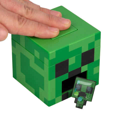 Hand pressing the Creeper sticker maker