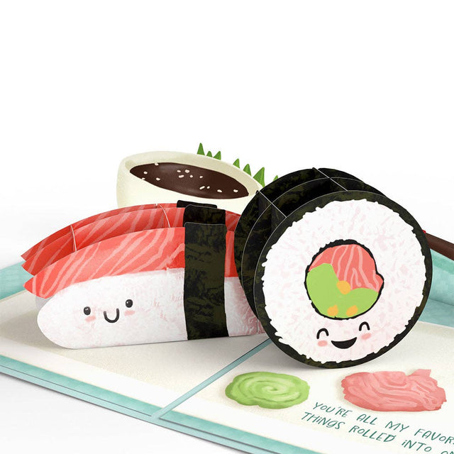 Smiling sushi pop-up scene with chopsticks and condiments