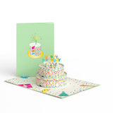 Sprinkles birthday cake card open beside its pale green cover